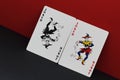 Game of imagination. Card allegory is red and black as symbol of opposites and contradictions in world. Red and black joker on