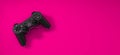 Game pad on pink background. girl power in game industry