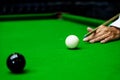 Game snooker billiards or opening frame player ready for the ball shot, athlete man kick cue on the green table in bar