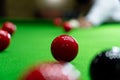 Game snooker billiards or opening frame player ready for the ball shot, athlete man kick cue on the green table in bar Royalty Free Stock Photo