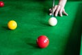 Game snooker billiards or opening frame player ready for the ball shot, athlete man kick cue on the green table in bar Royalty Free Stock Photo