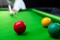 Game snooker billiards or opening frame player ready for the ball shot, athlete man kick cue on the green table in bar Royalty Free Stock Photo