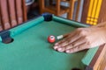 Game snooker ready for the ball shot on the green table in bar