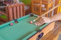 Game snooker ready for the ball shot on the green table in bar
