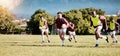Game, sports and men playing rugby in a competition, match and running with a ball on a field. Fitness, exercise and