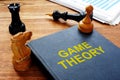 Game theory book and chess with documents Royalty Free Stock Photo