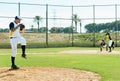 The game is about to become exciting. Full length shot of a handsome young baseball player pitching a ball during a Royalty Free Stock Photo
