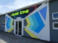 Game zone sign. A sign on the building for leisure and games. A place for games.