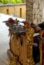 Gamelan music instrument surrounded by buildings under sunlight in Bali in Indonesia