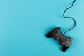 Gamepad on a blue background, weekend concept, gaming hobby. Copy space Royalty Free Stock Photo