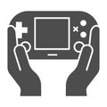 Gamepad in hands solid icon. Joypad in arms vector illustration isolated on white. Gaming glyph style design, designed