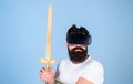 Gamer concept. Hipster on serious face enjoy play game in virtual reality. Man with beard in VR glasses, light blue Royalty Free Stock Photo