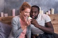 Gamer couple eating cupcakes in bedroom