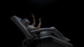 Gamer getting AI experience dark room. Haptic gloves woman sitting armchair