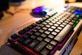 Gamer keyboard, gamer mouse on the blurred background