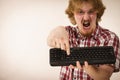 Gamer man holding computer keyboard Royalty Free Stock Photo