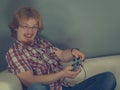 Gamer man playing using gaming pad Royalty Free Stock Photo