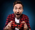gamer is playing a video game with his red joystick Royalty Free Stock Photo