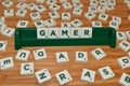 Gamer word made up of letter tiles surrounded by letters. Woden Table