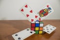 Games composition, rubik cube full of gaming cards