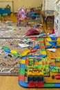 Games floor for preschoolers kindergarten. interior children`s room. mess in the room. Scattered toys. It`s hard being a housewi