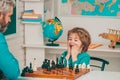 Games good for brain intelligence concept. Chess strategy. Father and son relaxing together. Child early development.