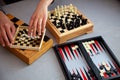 Board games on the table. Chess, backgammon, checkers. Boards are laid out for the game. Play, have fun at home. Leisure, hobbies