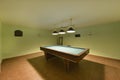 Games room on the ground floor of a detached house with a pool table and a dart board