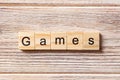 Games word written on wood block. games text on table, concept