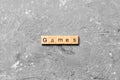 Games word written on wood block. games text on table, concept