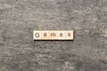 games word written on wood block. games text on table, concept