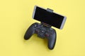 Gamesir g3s modern black gamepad for smartphone on yellow background close up