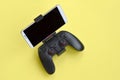Gamesir g3s modern black gamepad for smartphone on yellow background close up