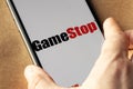 GameStop Corp stock logo on an iPhone screen.