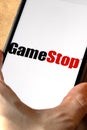 GameStop Corp stock logo on an iPhone screen.