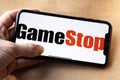 GameStop Corp stock logo on an iPhone screen.