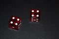 Gaming dice on black background