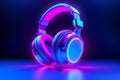 gaming headphones in neon light on a dark background.