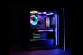 Gaming PC rainbow LED light Modern liquid cooled gaming computer Powerful PC glass case, front view Royalty Free Stock Photo