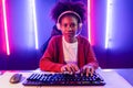 Gaming streamer, African girl playing online fighting with Esport. Tastemaker.