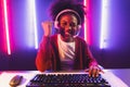 Gaming streamer, African girl playing online fighting with Esport. Tastemaker.