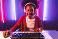 Gaming streamer, African girl playing online fighting with Esport. Tastemaker.