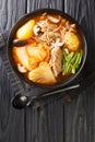 Gamjatang Pork Bone Korean Soup close up in the bowl. Vertical top view Royalty Free Stock Photo