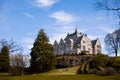 Gamlehaugen castle in Bergen, Norway behind the park. Warm spring color Royalty Free Stock Photo