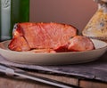 Gammon roast joint resting on plate.