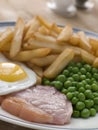 Gammon Steak Fried Egg Peas and Chips Royalty Free Stock Photo