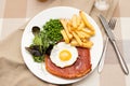 Gammon steak with a fried egg Royalty Free Stock Photo