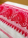 Gamosa or gamusa is a traditional textile pattern from Assam