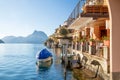 Gandria village in Lugano suburb - sheltered boat and houses next to water