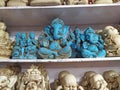Ganesha and Budha statues in Indian shop.